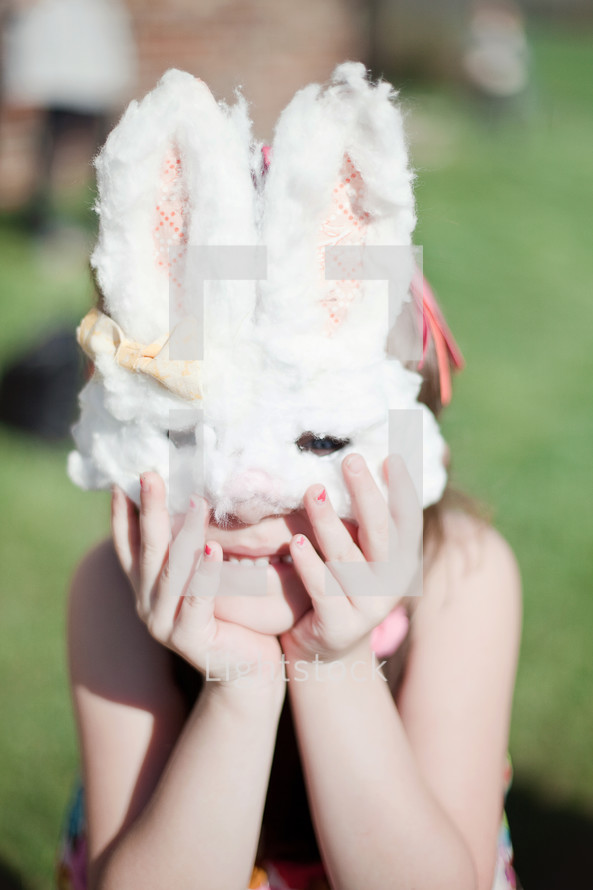 A child wearing a bunny mask 