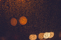 A window covered in raindrops. 