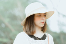 portrait of a young woman in a straw hat 