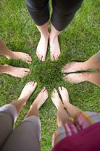 looking down at bare feet in a circle 