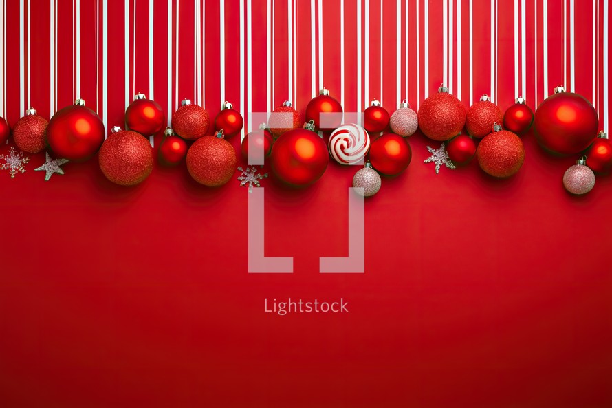 Christmas background with red balls and snowflakes on a red background