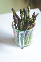 asparagus in a measuring cup 