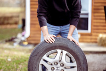 a man changing a tire 