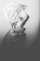Hand holding paper money, 