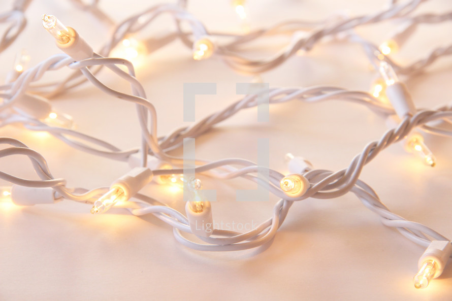 Christmas lights on white background 