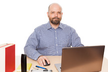man sitting at his desk in an office 