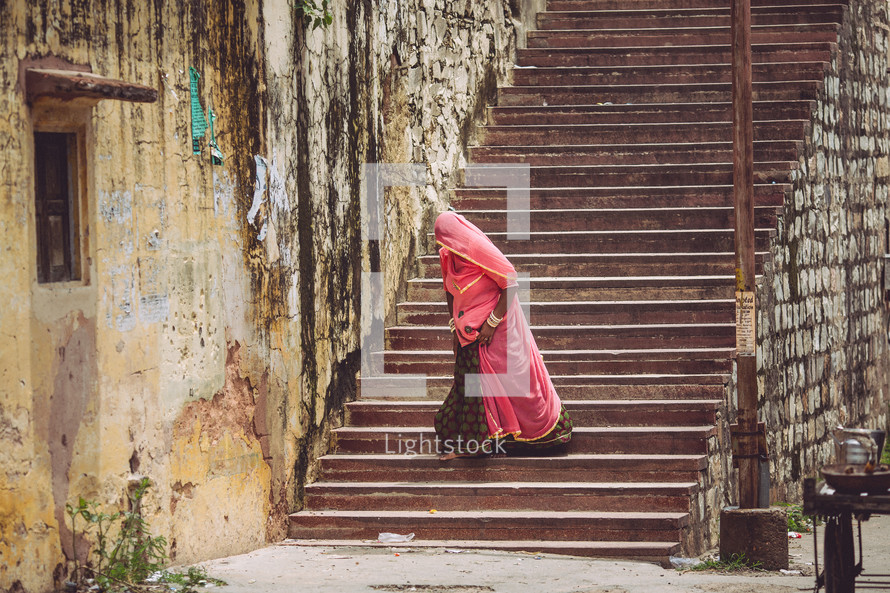 woman walking down stairs 