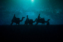 wisemen traveling on camels at night 