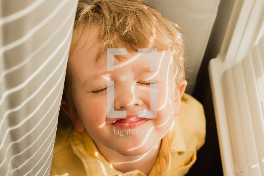 sunlight shining on a toddlers face 