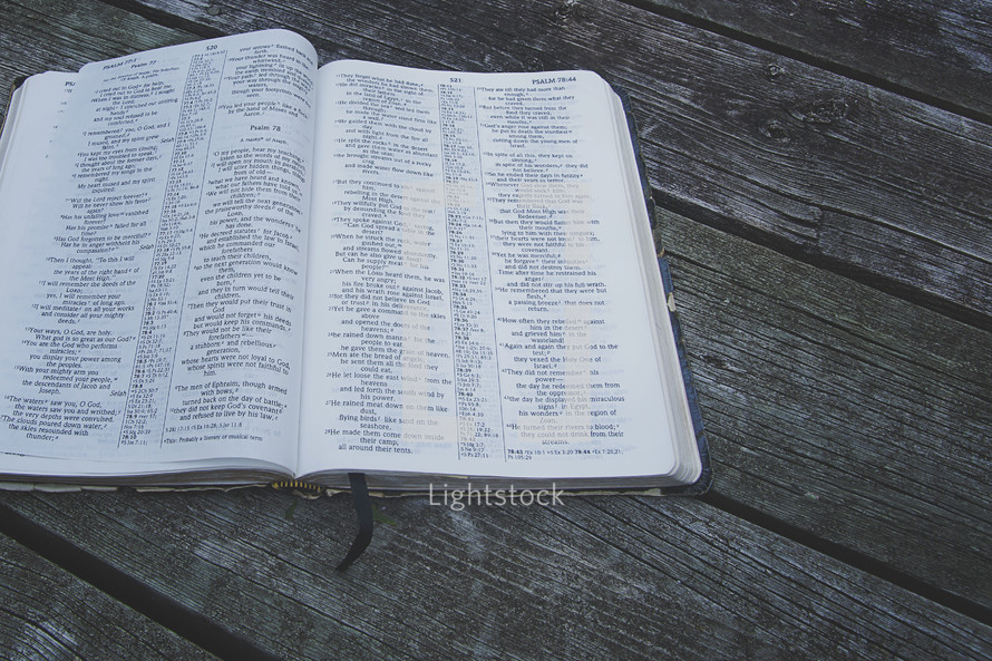 an open Bible on a deck 