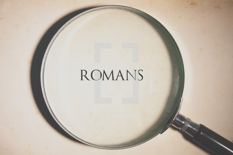 magnifying glass over Romans 