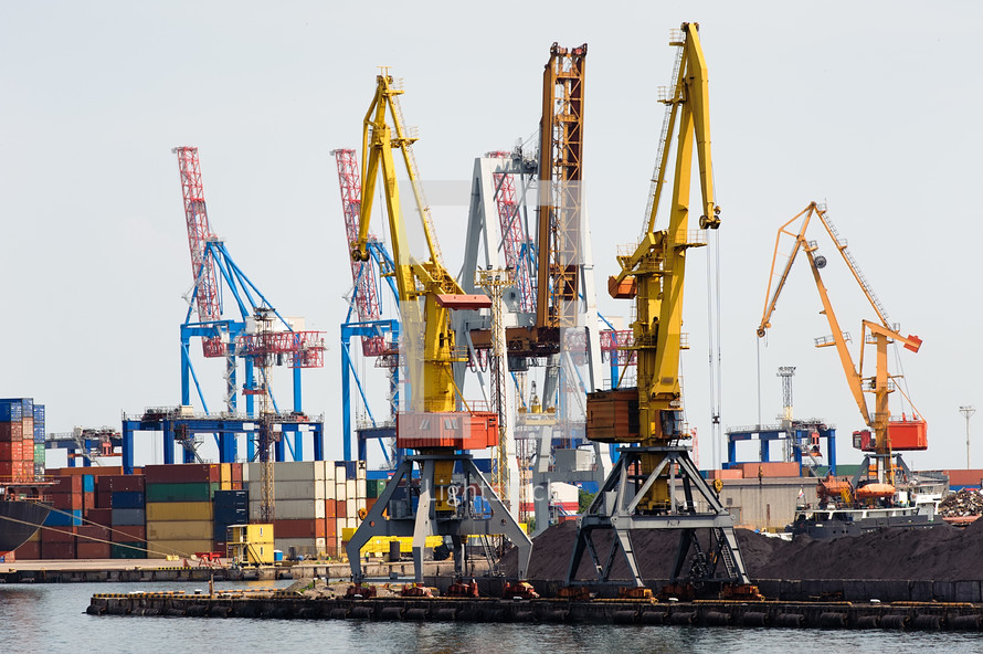 Industrial cranes and cargo on a quay