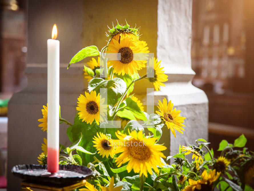 church sunflowers and candle 