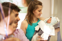 Family in the maternity hospital with infant