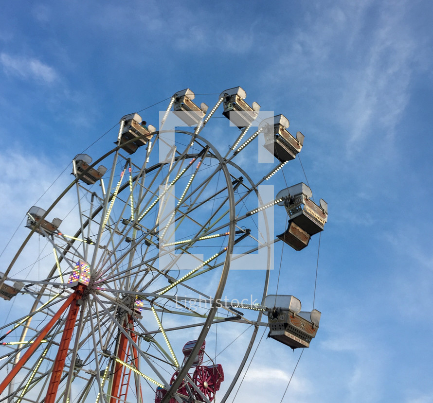 ferris wheel against a blue sky 