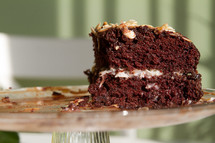 slice of chocolate cake on a cake stand 