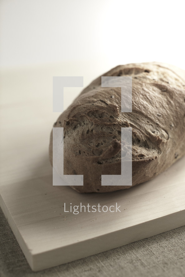 A loaf of bread on a cutting board