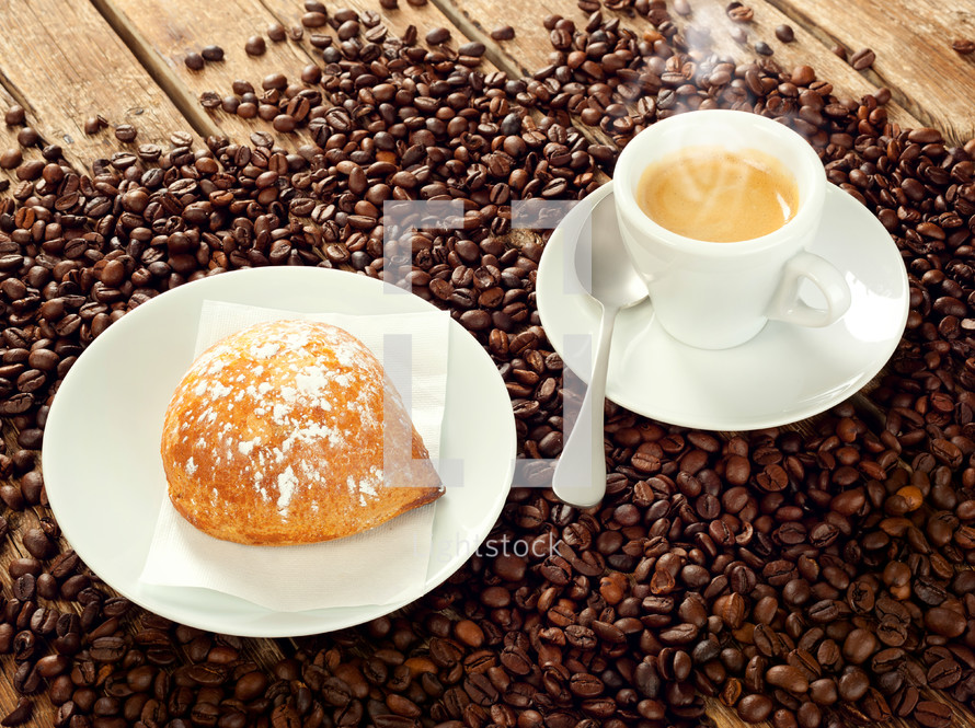 Neapolitan Sfogliatella frolla with cup of espresso coffee