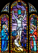 stained glass window of crucifixion 