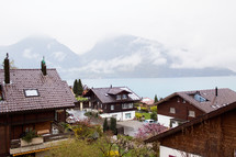 rooftops of homes along a shore in Switzerland 