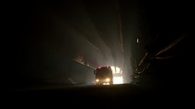 rescue truck driving into a dark construction tunnel