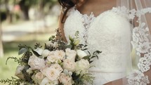 bride standing in her wedding gown 