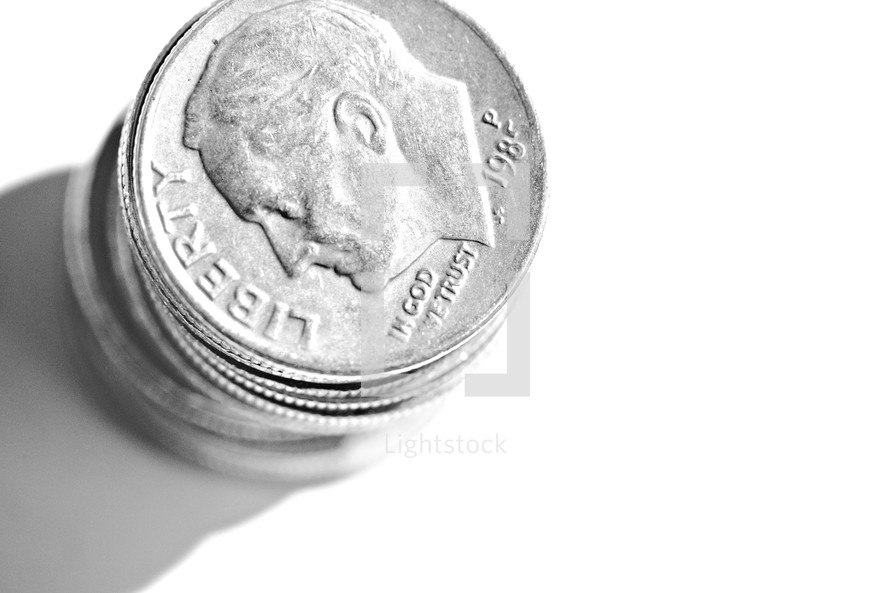Stack of dimes isolated on white