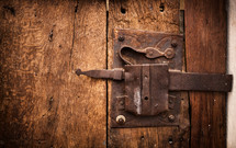 Old lock of a wooden door's Trullo in Alberobello, Italy