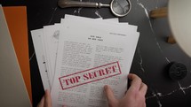 Top Secret Document on black table office