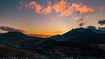 Aerial view of colorful evening in alpine countryside landscape after sunset 
