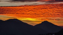 Bloody sunset over mountains Time lapse
