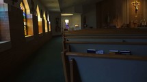 rows of pews in an empty church 