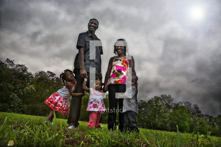 Family standing in field