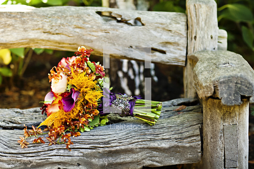 Bouquet of flowers on wood bench