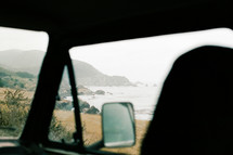 view of the beach out a van window 