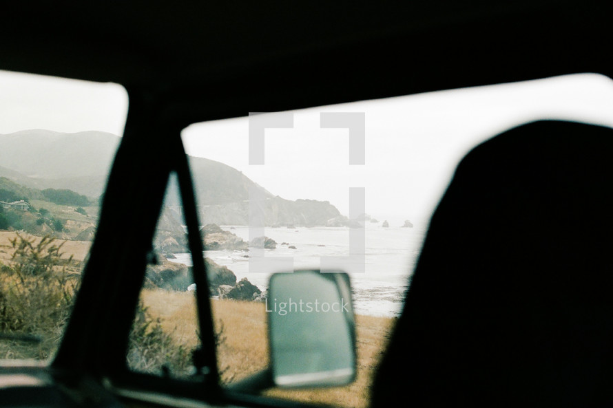 view of the beach out a van window 