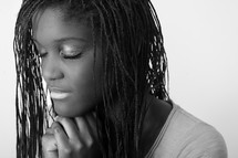 A teen girl praying. 