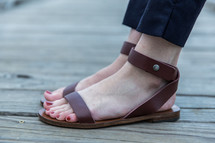 woman's feet in sandals 