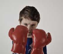 a boy with boxing gloves 