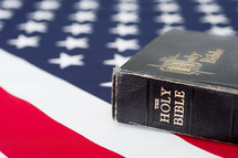 Holy Bible on an American flag.