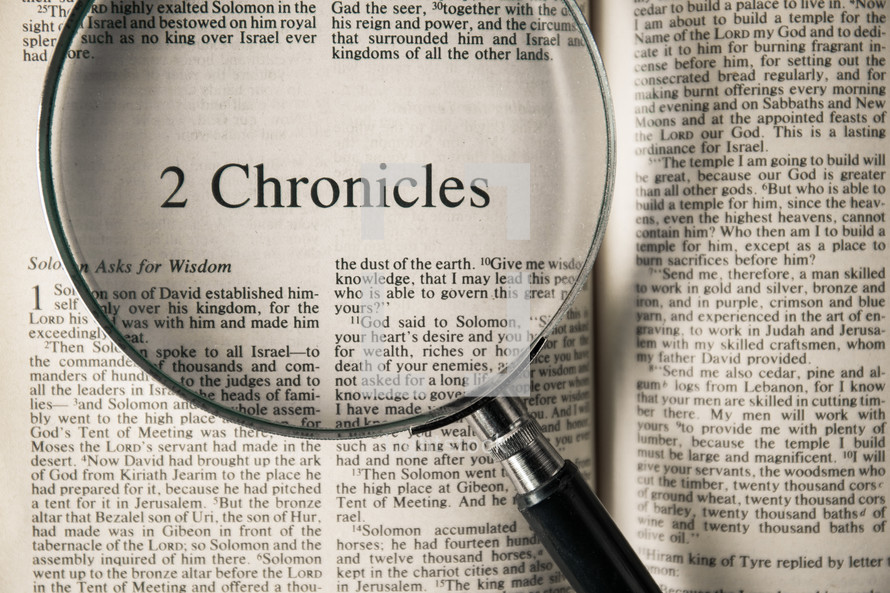 magnifying glass over Bible - 2 Chronicles 