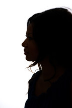 Silhouette of the profile of a woman.