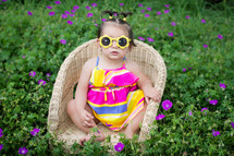 toddler girl in pigtails and sunglasses 