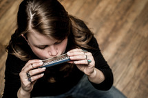 woman playing a harmonica