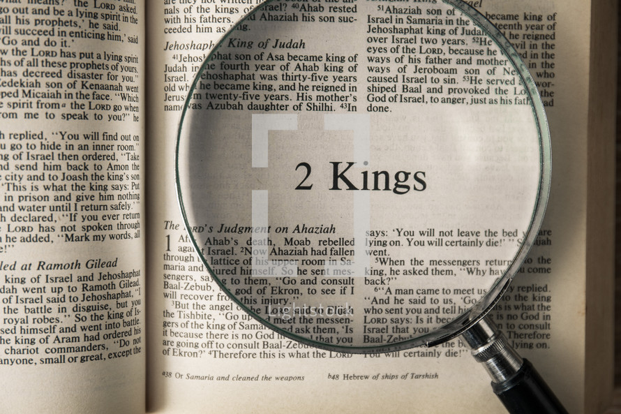magnifying glass over Bible - 2 Kings 