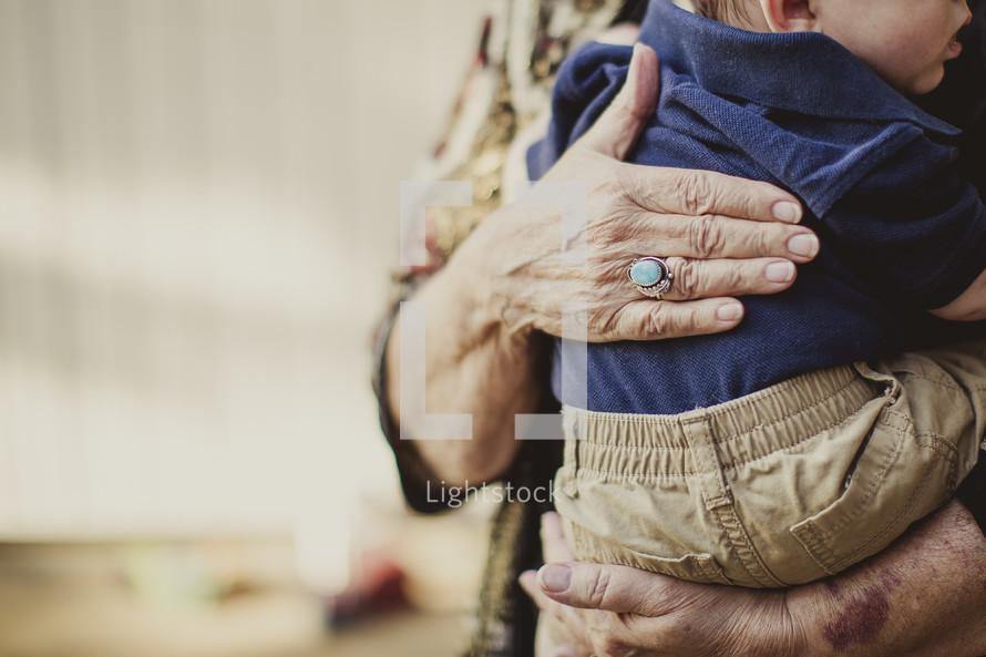 grandmother holding her grandson 