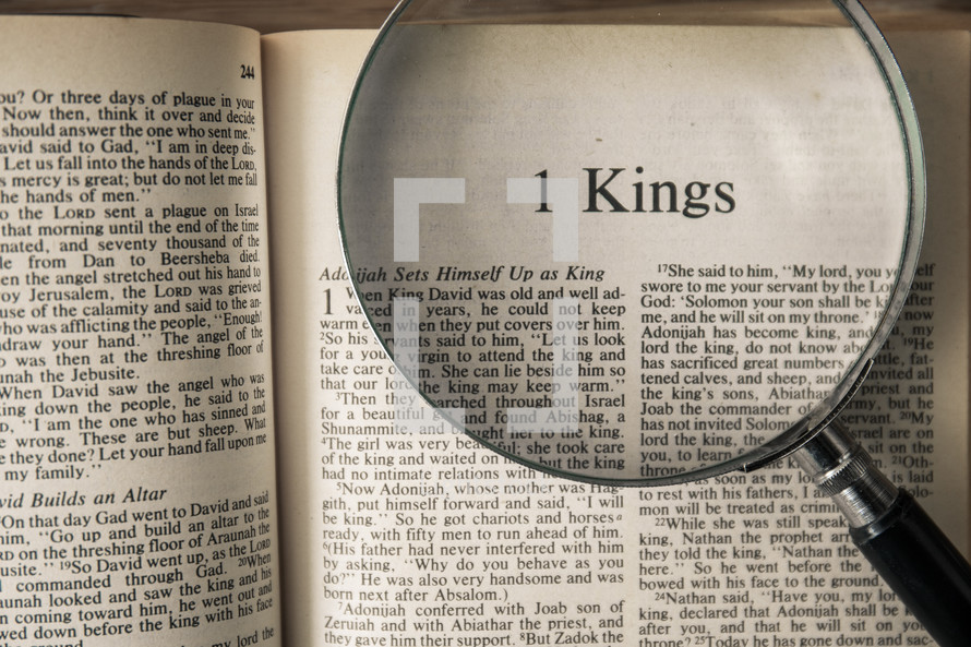 magnifying glass over Bible - 1 Kings 
