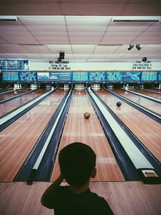 boy child at a bowling alley 