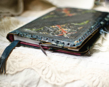 Worn, leather notebook. Prayer journal or Bible notes.