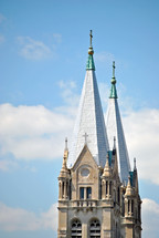 Richardsonian Romanesque architecture style in twin church steeples; Catholic church of St. Joseph, Joliet, IL
